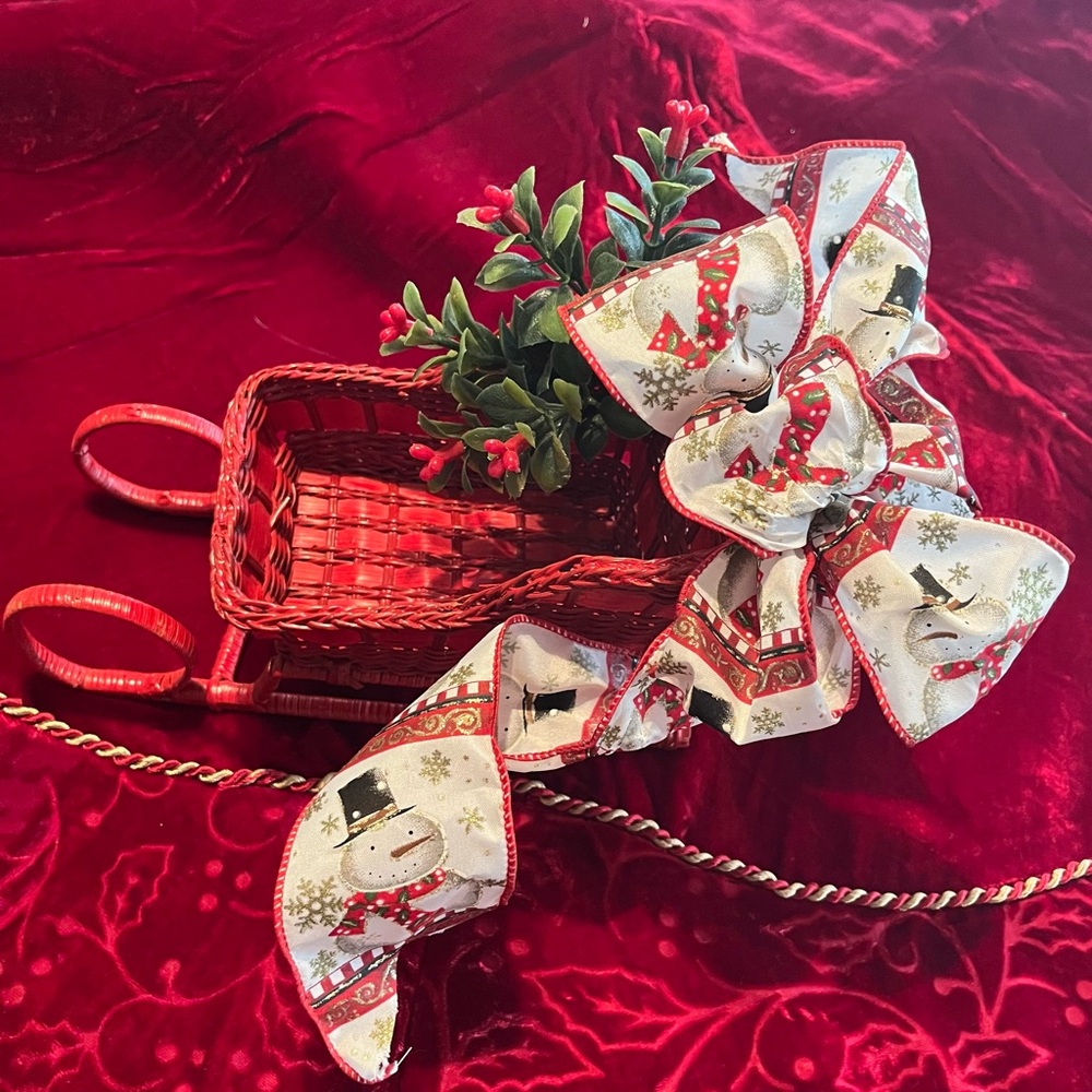 Festive Red Wicker Sleigh with Snowman Ribbon